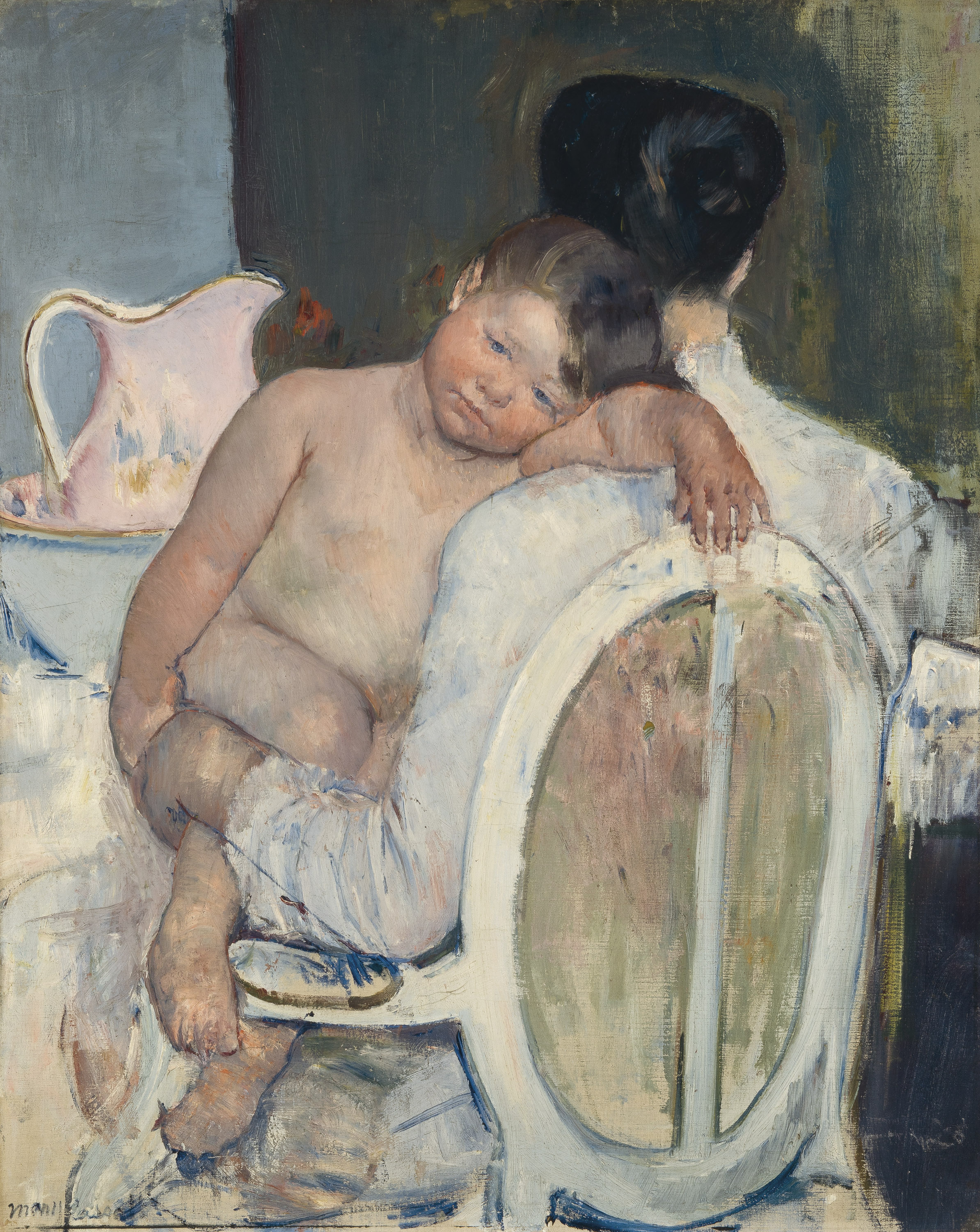 Mujer sentada con un niño en brazos